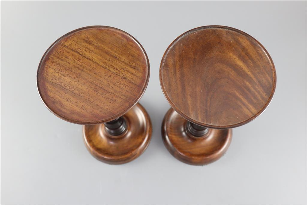 A pair of George III mahogany and ebony adjustable candle stands, height 8.75in.